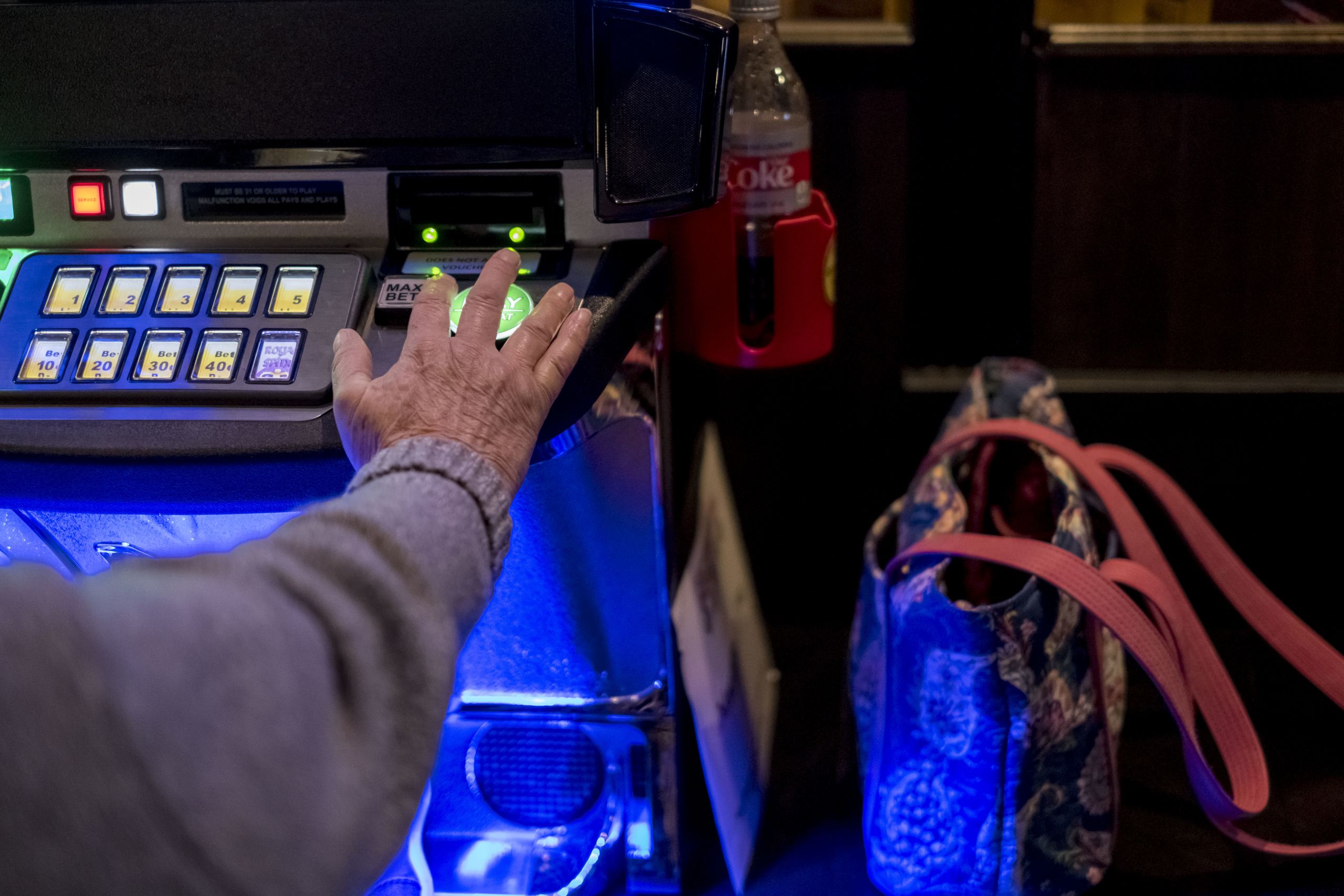 Janet Motsinger, 72, uses a video gambling machine at Sunset Inn and Suites in Clinton, Ill. (Whitney Curtis, special to ProPublica Illinois)