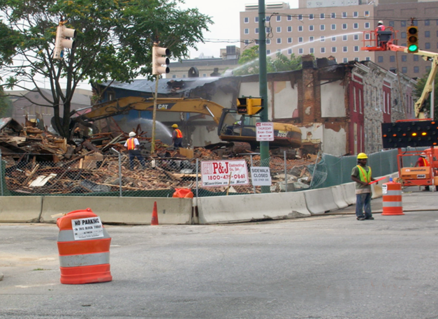 In order to reduce exposure to harmful dust, workers suppress dust by wetting down the debris. (Courtesy David Jacobs)