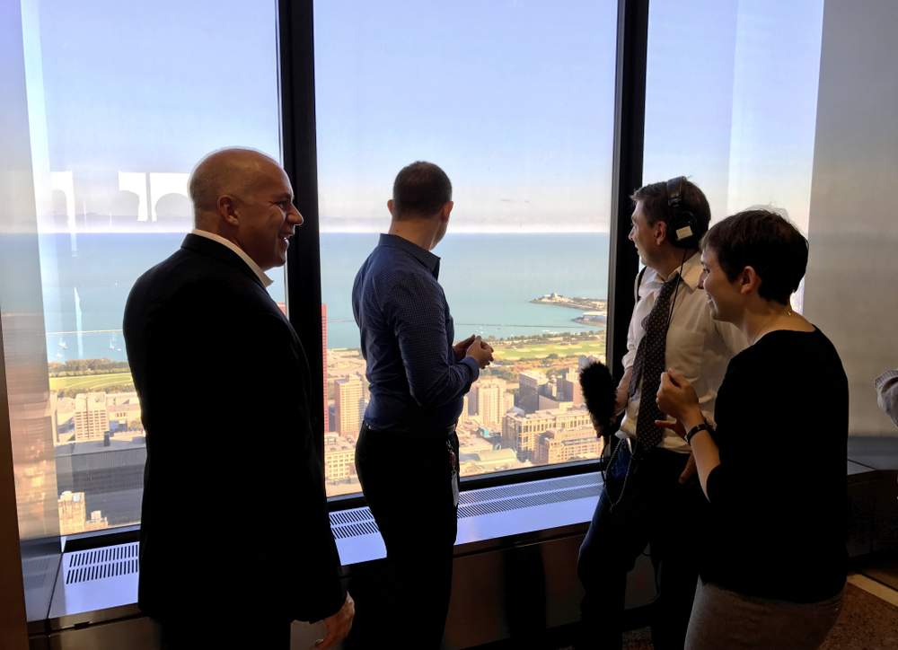 From left to right: Architect Gordon Gill, questioner Bill Muscat, producer Jesse Dukes and Chicago Architecture Foundation&#39;s Jen Masengarb gaze at the lake from their perch in the Willis Tower. (Courtesy of Marko Dumlija)
