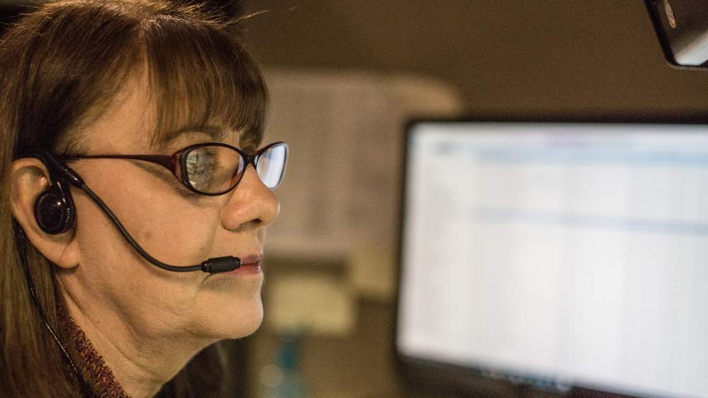 Janet Sisk works on gun traces in the call center at the ATF National Tracing Center. (Raymond Thompson Jr. for WBEZ)