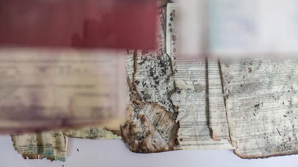 Gun receipts damaged in fires or natural disasters are displayed in a special case at the ATF National Tracing Center. (Raymond Thompson Jr. for WBEZ)