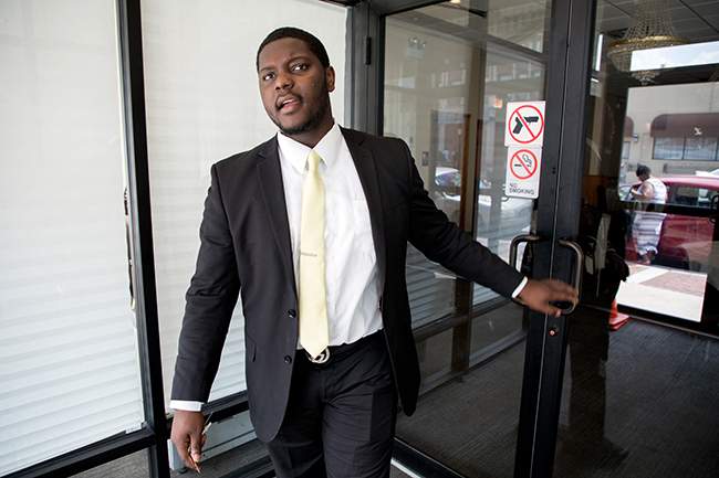 Mosley walks into Leak &amp;amp; Son&#39;s Funeral Homes, where&amp;nbsp;he has been working this summer. (Andrew Gill\/WBEZ)