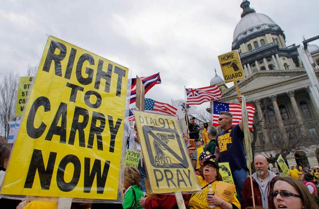 Gun owners and gun rights advocates rally at the Illinois State Capitol in 2012. (Seth Perlman\/AP Photo)
