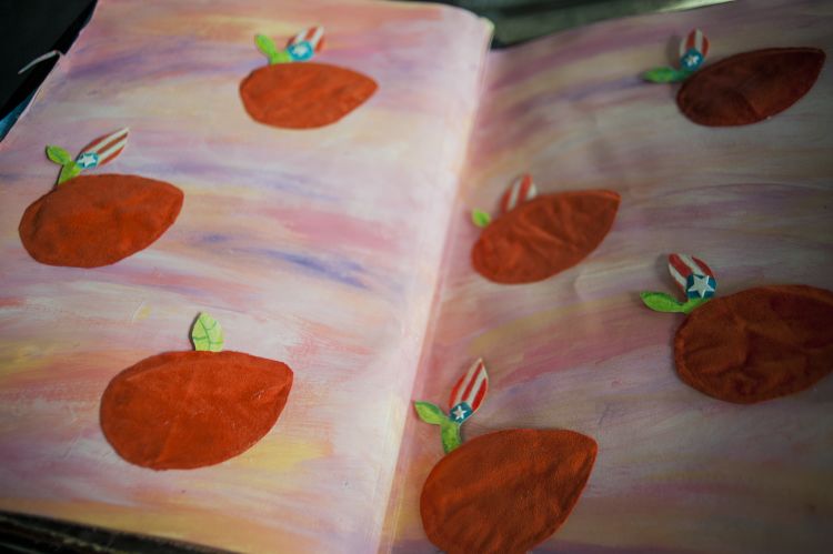 An illustration of mangos falling through a pink and purple sky. The mangos have Puerto Rican flags as leaves.