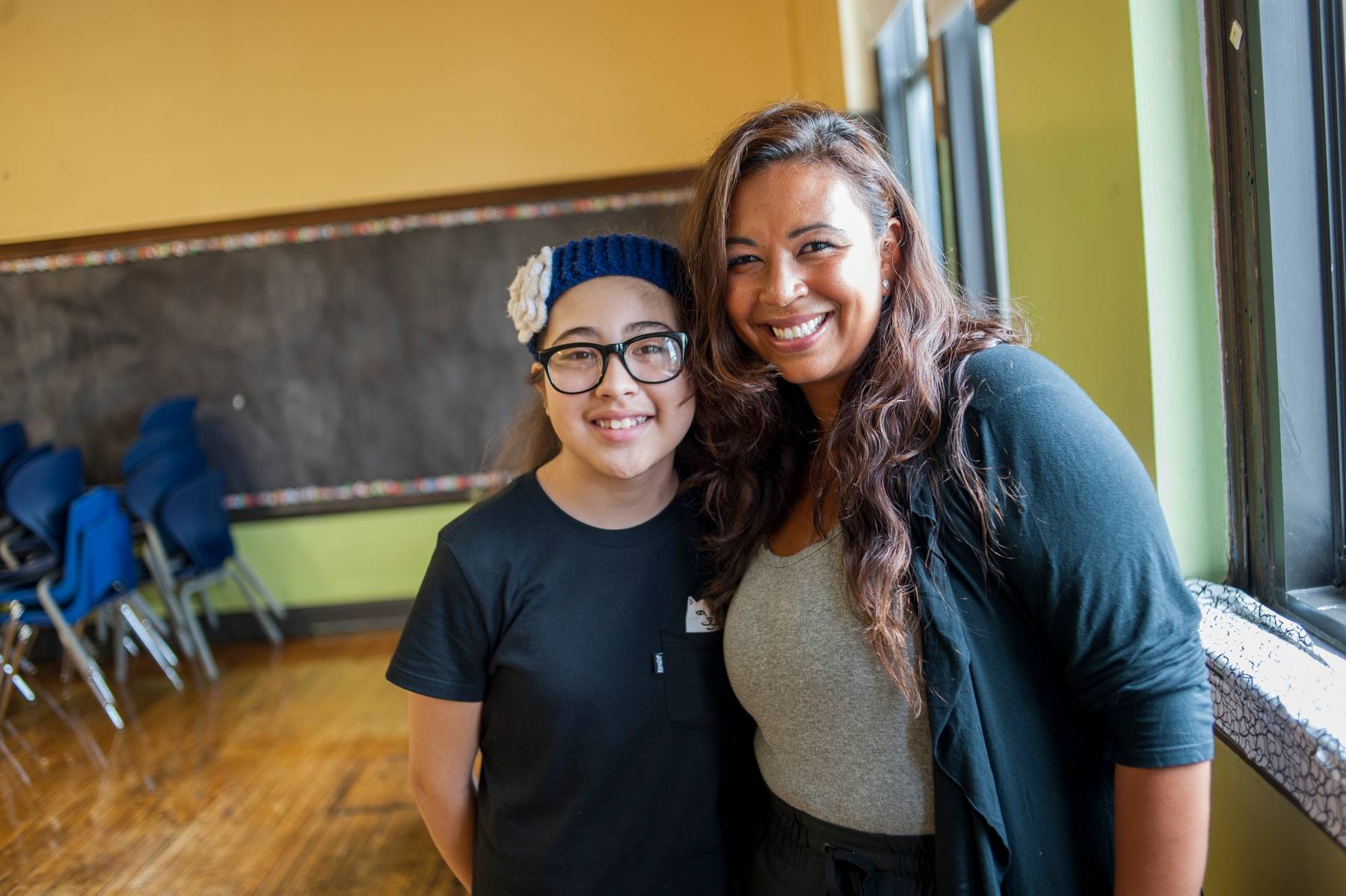 Elvalisa Guzman and her student smiling, looking directly at the camera